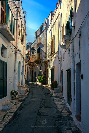 Narrow Alley Amidst Buildings In Ostuni, Italy