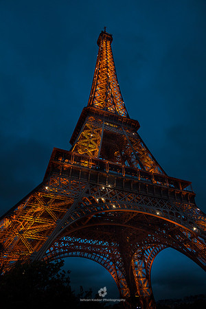 "Eiffel Tower", Night, "Paris - France", Illuminated, Architecture, France, "French Culture", "Building Exterior", "Capital Cities", "Colour Image", "Famous Place", "Gold Coloured", "International Lan