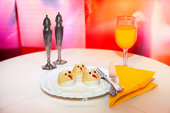 Breakfast, Chair, Chicks, "Colour Image", Cutlery, Decorated, "Eating Utensil", "Elevated View", Food, Fork, "Hatching Chicks", Indoors, Morning, Napkin, "No People", "Orange Juice", "Place Setting",