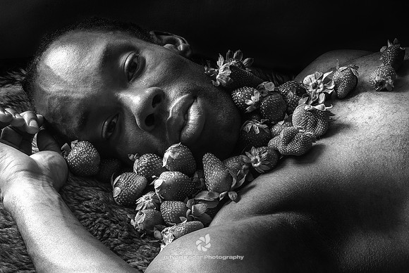 "Adults Only", "African American", Bed, Black, Close-Up, Contemplation, Hands, Horizontal, Indoors, "Lights & Shadows", "Looking At Camera", "Lying On Back", Man, "One Man Only", "One Person", "One Yo